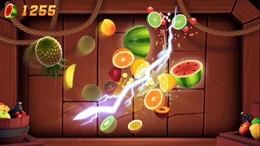 Fruit Ninja arcade mode in full swing with multiple fruits flying across the screen and score multipliers active